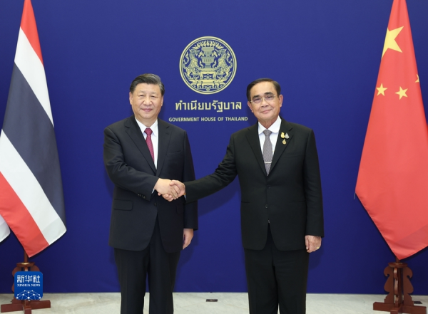 Xi meets with Thailand PM.jpg