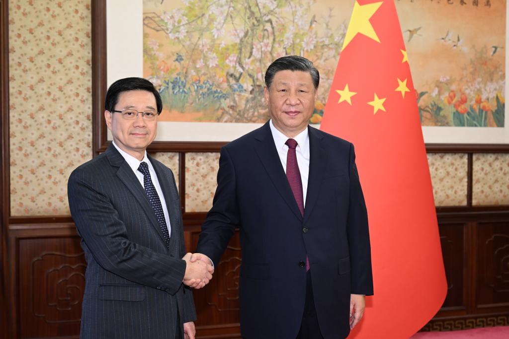 Xi Jinping hears report from HK SAR chief executive.jpg